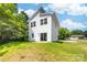 Exterior shot of back of white home featuring large windows at 413 Jose St, Shelby, NC 28150