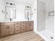 Bright bathroom featuring double vanity, quartz countertop, and marble-look tiled shower at 413 Jose St, Shelby, NC 28150