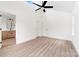Bright bedroom with an ensuite bathroom, large windows, and light wood flooring at 413 Jose St, Shelby, NC 28150