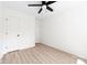 This bedroom features light-colored wood-look floors, neutral walls, and a ceiling fan at 413 Jose St, Shelby, NC 28150