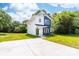 Contemporary two-story home featuring a sleek design, modern color scheme, and well-maintained lawn at 413 Jose St, Shelby, NC 28150