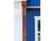 Close up shot of the house numbers on a wood beam next to a blue door at 413 Jose St, Shelby, NC 28150