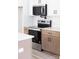 Modern kitchen features stainless steel appliances, two tone cabinets, and white subway tile backsplash at 413 Jose St, Shelby, NC 28150