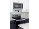 Kitchen with stainless microwave, oven, range and tile backsplash at 413 Jose St, Shelby, NC 28150