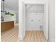 Bright laundry room closet with light wood flooring at 413 Jose St, Shelby, NC 28150