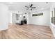 Bright, open living room and kitchen feature light wood floors and modern fixtures at 413 Jose St, Shelby, NC 28150