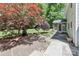 Attractive backyard featuring a fire pit, screened in porch, and mature maple trees providing a private retreat at 417 Florence Cir, Statesville, NC 28625