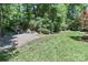 Backyard area with multiple seating arrangements and lush green grass, ideal for relaxation at 417 Florence Cir, Statesville, NC 28625