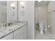 Modern bathroom with white cabinets, granite countertop, glass shower, and stylish lighting at 417 Florence Cir, Statesville, NC 28625