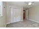 Clean bedroom with closet and en-suite access features neutral walls and plush carpeting at 417 Florence Cir, Statesville, NC 28625