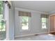 Cozy bedroom featuring crown molding, two large windows with patterned cornices, and neutral carpet at 417 Florence Cir, Statesville, NC 28625