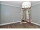 Light and airy dining room with hardwood floors, large window, and modern lighting, perfect for Gathering meals at 417 Florence Cir, Statesville, NC 28625