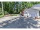 Spacious driveway and garage bordered by greenery creates a sense of privacy and welcome at 417 Florence Cir, Statesville, NC 28625
