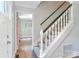 Welcoming foyer features a carpeted staircase with natural light and hardwood floors leading to other rooms at 417 Florence Cir, Statesville, NC 28625