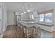 Bright kitchen features a center island with seating, modern appliances, and window seating at 417 Florence Cir, Statesville, NC 28625