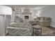 Well-lit living room features a white brick fireplace with built-in shelving and comfortable seating at 417 Florence Cir, Statesville, NC 28625