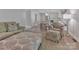 Cozy living space flows into kitchen, featuring modern furniture and hardwood floors at 417 Florence Cir, Statesville, NC 28625