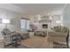 Inviting living room with built-in bookshelves, brick fireplace, and comfortable seating at 417 Florence Cir, Statesville, NC 28625