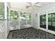 Interior view of screened porch providing indoor / outdoor living with a sliding door and leafy view at 417 Florence Cir, Statesville, NC 28625