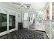 Inviting screened porch featuring stylish lattice work and a contemporary ceiling fan fixture at 417 Florence Cir, Statesville, NC 28625