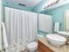 Bathroom featuring a white sink, matching white toilet, shower with curtain, and granite countertop at 517 N Graham St # 3E, Charlotte, NC 28202