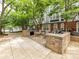 Community grilling area with built-in gas grills and tables, perfect for outdoor cooking and entertaining at 517 N Graham St # 3E, Charlotte, NC 28202