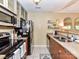Efficient kitchen with stainless steel appliances and granite countertops at 517 N Graham St # 3E, Charlotte, NC 28202