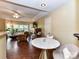 Inviting living room with hardwood floors, a fireplace, and a connected dining area at 517 N Graham St # 3E, Charlotte, NC 28202