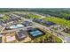 Aerial view of new construction community featuring pool, pickleball court, and modern homes at 527 Sunharvest Ln, Indian Trail, NC 28079