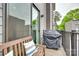 Balcony featuring a Weber grill with a patio bench and view of the neighborhood at 556 Billingsley Rd, Charlotte, NC 28211