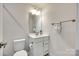 Clean bathroom with white vanity, modern fixtures, and ample lighting at 556 Billingsley Rd, Charlotte, NC 28211