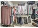 Walk-in closet with ample hanging space and shelving, offering organized storage for clothing and accessories at 556 Billingsley Rd, Charlotte, NC 28211