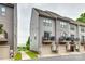 Modern townhome exterior, with individual garages, balconies, and neutral gray siding at 556 Billingsley Rd, Charlotte, NC 28211
