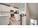 Modern kitchen with white cabinets, stainless steel appliances, and a kitchen island at 556 Billingsley Rd, Charlotte, NC 28211