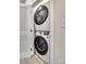 Convenient laundry area with stackable washer and dryer units tucked away in a closet at 556 Billingsley Rd, Charlotte, NC 28211