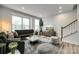 Beautiful living room with large windows for natural light and decorative fireplace at 556 Billingsley Rd, Charlotte, NC 28211