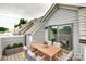 Rooftop deck area provides outdoor dining or entertaining space, and partial neighborhood views at 556 Billingsley Rd, Charlotte, NC 28211