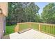 New back deck overlooking the yard with green grass and green trees at 5564 N Hillsdale Dr, Fort Lawn, SC 29714