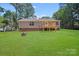 Well-maintained backyard featuring a wooden deck and lush green lawn, ideal for outdoor gatherings and recreation at 5564 N Hillsdale Dr, Fort Lawn, SC 29714
