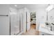 Fresh bathroom with a glass shower, double vanity, modern fixtures, and a view into the bedroom at 5564 N Hillsdale Dr, Fort Lawn, SC 29714
