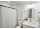 Bathroom featuring a shower with white curtain, white toilet and sink, and simple decor at 5564 N Hillsdale Dr, Fort Lawn, SC 29714