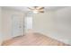 Clean bedroom with a ceiling fan, neutral walls, two closets, and light-colored flooring at 5564 N Hillsdale Dr, Fort Lawn, SC 29714