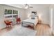 Inviting bedroom with natural light, wood floors, and a black metal bed frame at 5564 N Hillsdale Dr, Fort Lawn, SC 29714