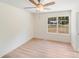 Bedroom with a ceiling fan, window view to outside, and light wood floors at 5564 N Hillsdale Dr, Fort Lawn, SC 29714