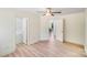Neutral bedroom with a ceiling fan and doorway into a connected space with a window at 5564 N Hillsdale Dr, Fort Lawn, SC 29714