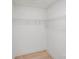 Bright walk-in closet featuring white walls, wire shelving, and a wood-look floor at 5564 N Hillsdale Dr, Fort Lawn, SC 29714