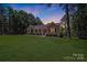 Charming home with a covered front porch, neat landscaping, and a well-manicured lawn at 5564 N Hillsdale Dr, Fort Lawn, SC 29714