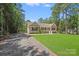 Attractive home with a gravel driveway, manicured lawn, and inviting front porch at 5564 N Hillsdale Dr, Fort Lawn, SC 29714