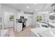 Modern kitchen with white cabinets, stainless steel appliances, and sleek countertops at 5564 N Hillsdale Dr, Fort Lawn, SC 29714