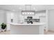 Charming kitchen featuring white cabinets, modern appliances, and a breakfast bar at 5564 N Hillsdale Dr, Fort Lawn, SC 29714